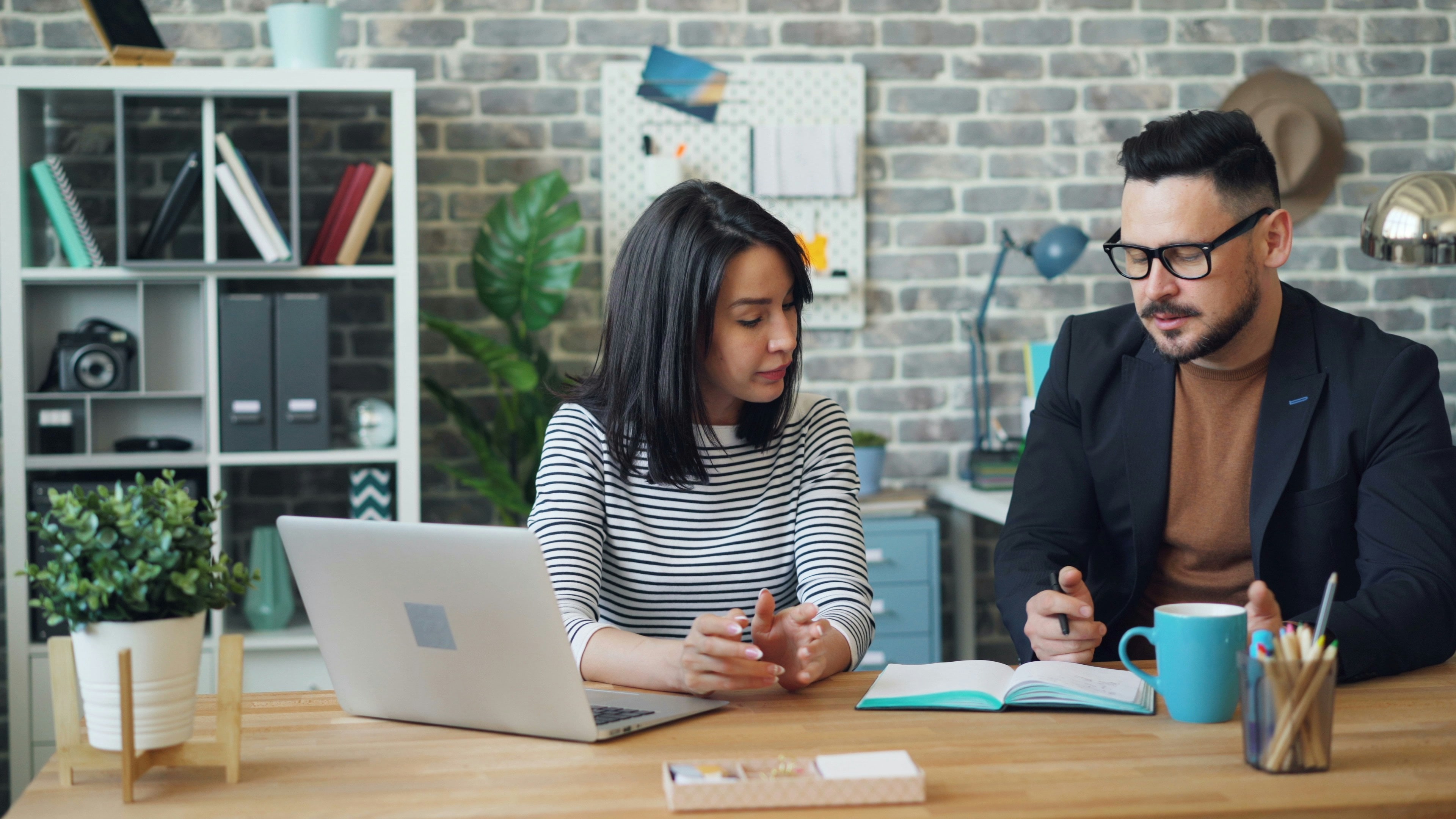 A support coordinator reviewing a referral with a colleague