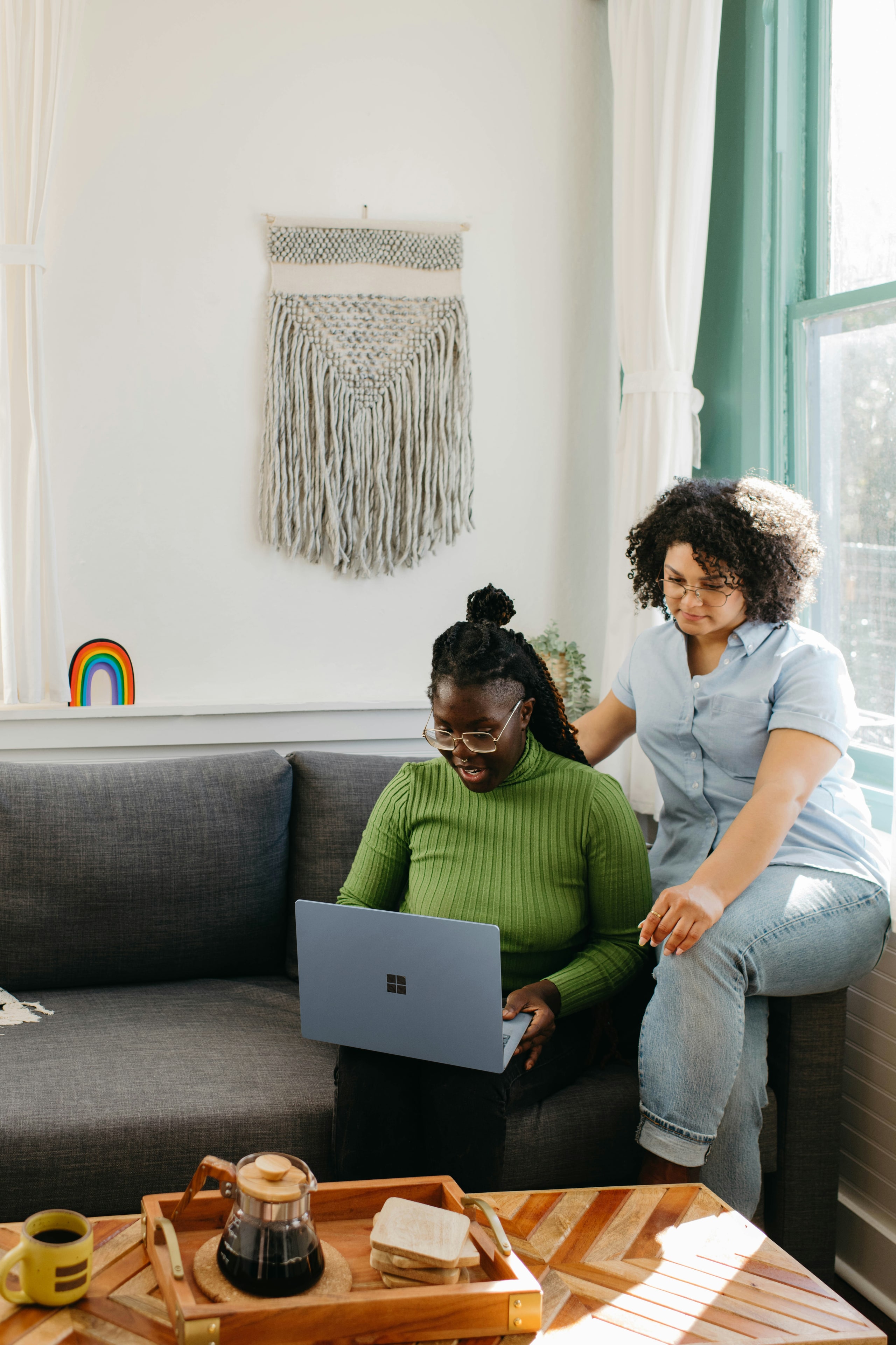 A support worker and resident building a support plan together at a table